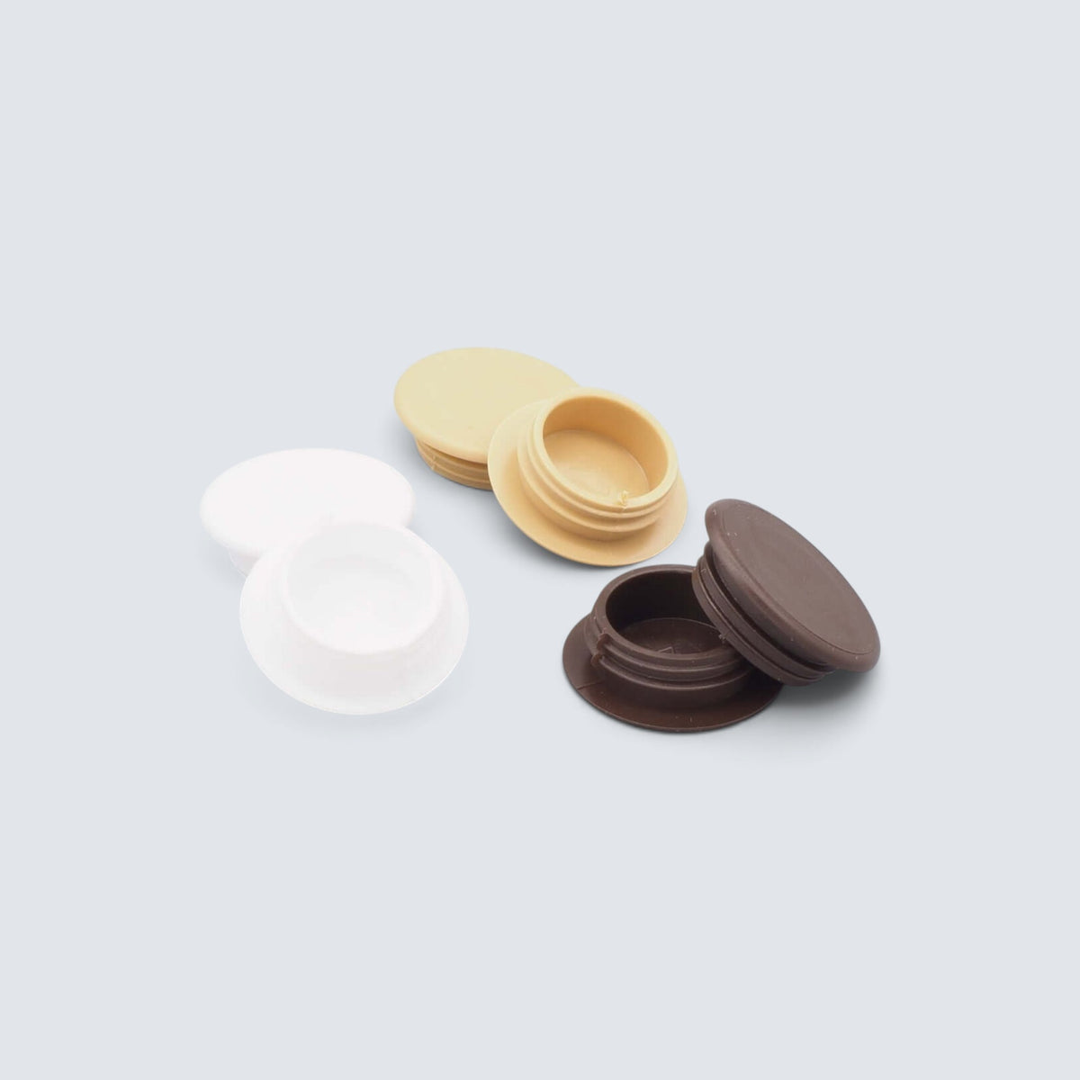 Täcklock i PVC för karmskruv i vitt, beige och brunt med 14 mm innerdiameter för snygg täckning vid montering av fönster och dörrar.